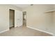 Neutral bedroom features tiled floors, closet, and an attached door for a cohesive design at 6941 58Th N Way, Pinellas Park, FL 33781