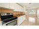 Kitchen with granite countertops, tile flooring, and stainless steel appliances at 6941 58Th N Way, Pinellas Park, FL 33781