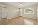 Bright and airy living room featuring ceramic tile flooring, a ceiling fan, and ample natural light at 6941 58Th N Way, Pinellas Park, FL 33781