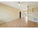 Bright living room featuring ceramic tile floors and an overhead ceiling fan at 6941 58Th N Way, Pinellas Park, FL 33781