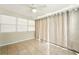 Sun room with tile flooring, neutral walls, curtained sliding glass doors, and ceiling fan at 6941 58Th N Way, Pinellas Park, FL 33781