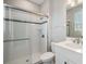 Clean bathroom with a glass-enclosed shower and white vanity with chrome faucet at 7276 Notched Pine Bnd, Wesley Chapel, FL 33545