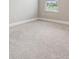 Cozy bedroom with neutral carpet and base trim at 7276 Notched Pine Bnd, Wesley Chapel, FL 33545