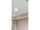 Tray ceiling bedroom with large windows and bathroom access at 7276 Notched Pine Bnd, Wesley Chapel, FL 33545