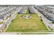 Aerial view of the community park showcasing a playground and green space for residents at 7276 Notched Pine Bnd, Wesley Chapel, FL 33545