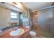 Bathroom featuring a vanity, toilet, and shower with sliding glass doors at 7309 Monterey Blvd, Tampa, FL 33625