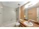 Bathroom showcasing a sink, tub, and floral wallpaper at 7309 Monterey Blvd, Tampa, FL 33625