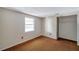 A bright bedroom features a window and closet space at 7309 Monterey Blvd, Tampa, FL 33625