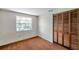Bedroom featuring window and closet with louvered doors at 7309 Monterey Blvd, Tampa, FL 33625
