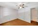 Bedroom featuring ceiling fan and doorway to the en suite bathroom at 7309 Monterey Blvd, Tampa, FL 33625