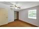 Bedroom featuring a window and closet with louvered doors at 7309 Monterey Blvd, Tampa, FL 33625