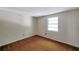 This bedroom features one window and brown carpeting at 7309 Monterey Blvd, Tampa, FL 33625
