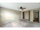 Bedroom featuring a ceiling fan and a closet with folding doors at 7309 Monterey Blvd, Tampa, FL 33625