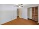 Bedroom featuring ceiling fan, closet space and doorway at 7309 Monterey Blvd, Tampa, FL 33625