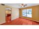 Dining room with wood flooring, tan colored walls, and access to adjacent rooms at 7309 Monterey Blvd, Tampa, FL 33625