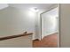 View of the upstairs hallway featuring carpeted floors, neutral walls, and a ceiling light at 7309 Monterey Blvd, Tampa, FL 33625