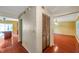 Hallway features wood floors, access to kitchen and living areas, plus a closet at 7309 Monterey Blvd, Tampa, FL 33625
