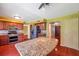 Kitchen with stainless steel appliances, a breakfast bar, and access to other rooms at 7309 Monterey Blvd, Tampa, FL 33625