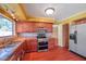Well-lit kitchen with stainless steel appliances, granite countertops, and wooden cabinets at 7309 Monterey Blvd, Tampa, FL 33625