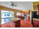 Kitchen with a breakfast bar, stainless steel appliances, and wooden cabinets at 7309 Monterey Blvd, Tampa, FL 33625