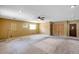 This spacious living room features a fan and carpet at 7309 Monterey Blvd, Tampa, FL 33625