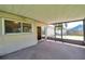 Spacious screened-in porch overlooks a green lawn and leads to the interior through a sliding glass door at 7309 Monterey Blvd, Tampa, FL 33625