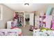 Bedroom featuring shelving, two beds and closet storage at 8524 Winter Haven Dr, Hudson, FL 34667