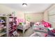 Bright bedroom featuring two beds, carpeted floors, and natural light at 8524 Winter Haven Dr, Hudson, FL 34667
