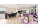 Open kitchen and dining area with tile floors and lots of space at 8524 Winter Haven Dr, Hudson, FL 34667