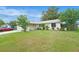 Charming one-story home featuring a well-maintained lawn, mature landscaping, and a driveway at 8524 Winter Haven Dr, Hudson, FL 34667