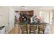Spacious kitchen with dark wood cabinets, black countertops, and an island with bar seating at 8524 Winter Haven Dr, Hudson, FL 34667