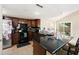 Well-lit kitchen features dark cabinets, bar countertop, and stainless steel appliances at 8524 Winter Haven Dr, Hudson, FL 34667