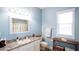 Bathroom featuring a single vanity, decorative mirror, and natural lighting from the window at 8679 Burning Tree Cir, Seminole, FL 33777