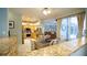 Comfortable dining room with a view to the living room and backyard patio at 8679 Burning Tree Cir, Seminole, FL 33777