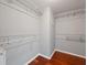 A walk-in closet offers wood floors and wire shelving at 9008 Egret Cove Cir, Riverview, FL 33578
