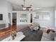 Spacious living area with modern decor, hardwood flooring, and bar area, ideal for entertaining at 9008 Egret Cove Cir, Riverview, FL 33578