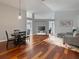 Bright living room with hardwood floors, high ceilings, and neutral paint, flowing to other spaces at 9008 Egret Cove Cir, Riverview, FL 33578