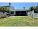 This backyard features a grassy area perfect for outdoor activities and gatherings at 907 San Carlos Ne Ave, St Petersburg, FL 33702