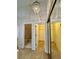View of the closets and ensuite bathroom in the main bedroom with carpet floors at 907 San Carlos Ne Ave, St Petersburg, FL 33702