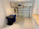 Attached garage featuring an automatic door and some open storage space for a compact car or storage at 907 San Carlos Ne Ave, St Petersburg, FL 33702