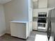 Modern kitchen features stainless steel appliances and ample cabinet space for storage at 907 San Carlos Ne Ave, St Petersburg, FL 33702