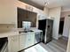 Well-lit kitchen with a view of the dining room and the lake, showcasing a functional design at 907 San Carlos Ne Ave, St Petersburg, FL 33702