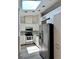 Bright kitchen equipped with stainless steel appliances, ample storage, and a skylight at 907 San Carlos Ne Ave, St Petersburg, FL 33702