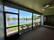 Relaxing lanai with a scenic lake view, providing a peaceful outdoor space at 907 San Carlos Ne Ave, St Petersburg, FL 33702