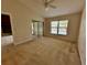 Main bedroom featuring a fan, a sliding door to the patio and a view of the lake at 907 San Carlos Ne Ave, St Petersburg, FL 33702