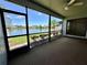Relax on the screened-in lanai with peaceful lake views at 907 San Carlos Ne Ave, St Petersburg, FL 33702