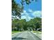 Neighborhood street with mature trees and a peaceful atmosphere at 907 San Carlos Ne Ave, St Petersburg, FL 33702