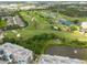 Aerial view of a condo community with a golf course nearby at 960 Starkey Rd # 2103, Largo, FL 33771