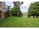 Lush backyard overlooking a serene lake and surrounding trees, offering a peaceful outdoor retreat at 960 Starkey Rd # 2103, Largo, FL 33771