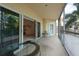 Spacious screened balcony with seating area and sliding glass doors leading indoors, offering a seamless indoor-outdoor flow at 960 Starkey Rd # 2103, Largo, FL 33771